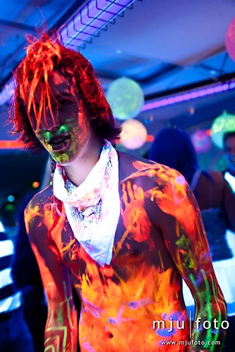 Photo of Crazy glow party guy glowing under black light